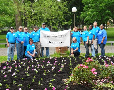 Volunteers from Domionion plant the garden at North & Cedar Aves.