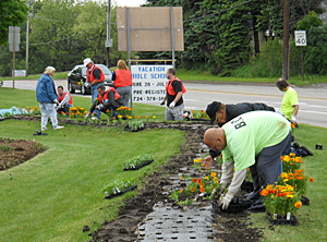 Volunteers plant the garden at Brodhead and Kennedy in Aliquippa
